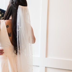 Beautiful cathedral length pearl veil.